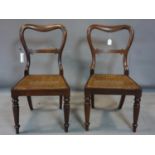 A pair of 19th century rosewood chairs with cane seats