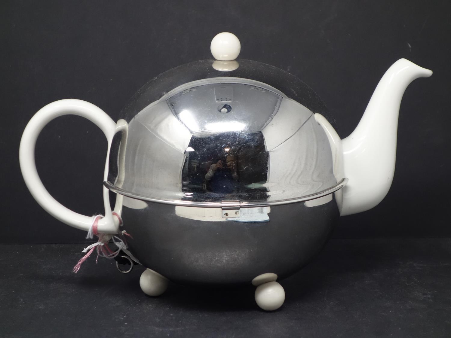 A Mariage Freres Art Deco 1930 Isotherm stoneware teapot, within polished steel globe - Image 2 of 5