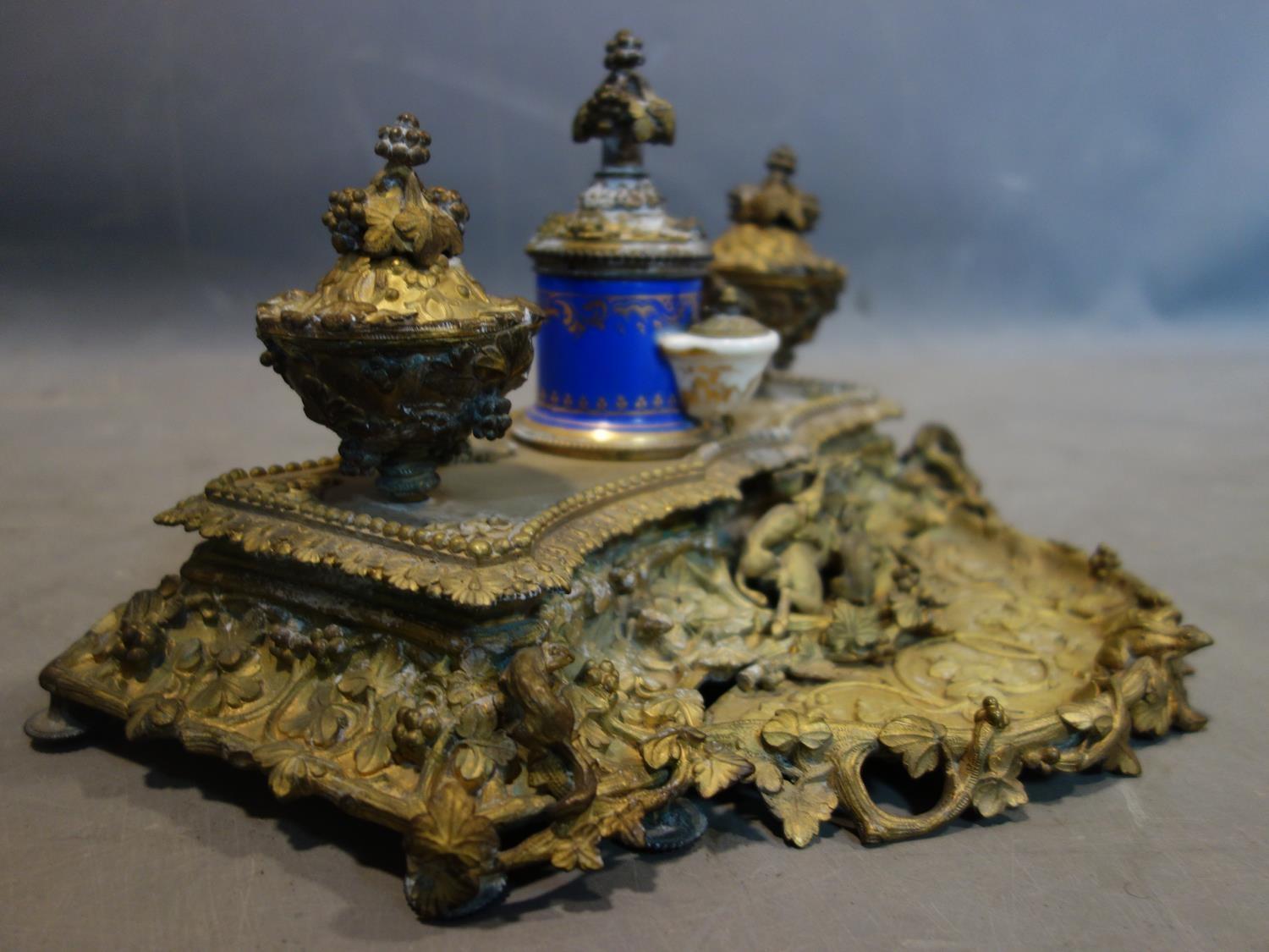 A 19th century French ormolu ink desk stand, with central porcelain pot and applied animals, H.20 - Image 4 of 5