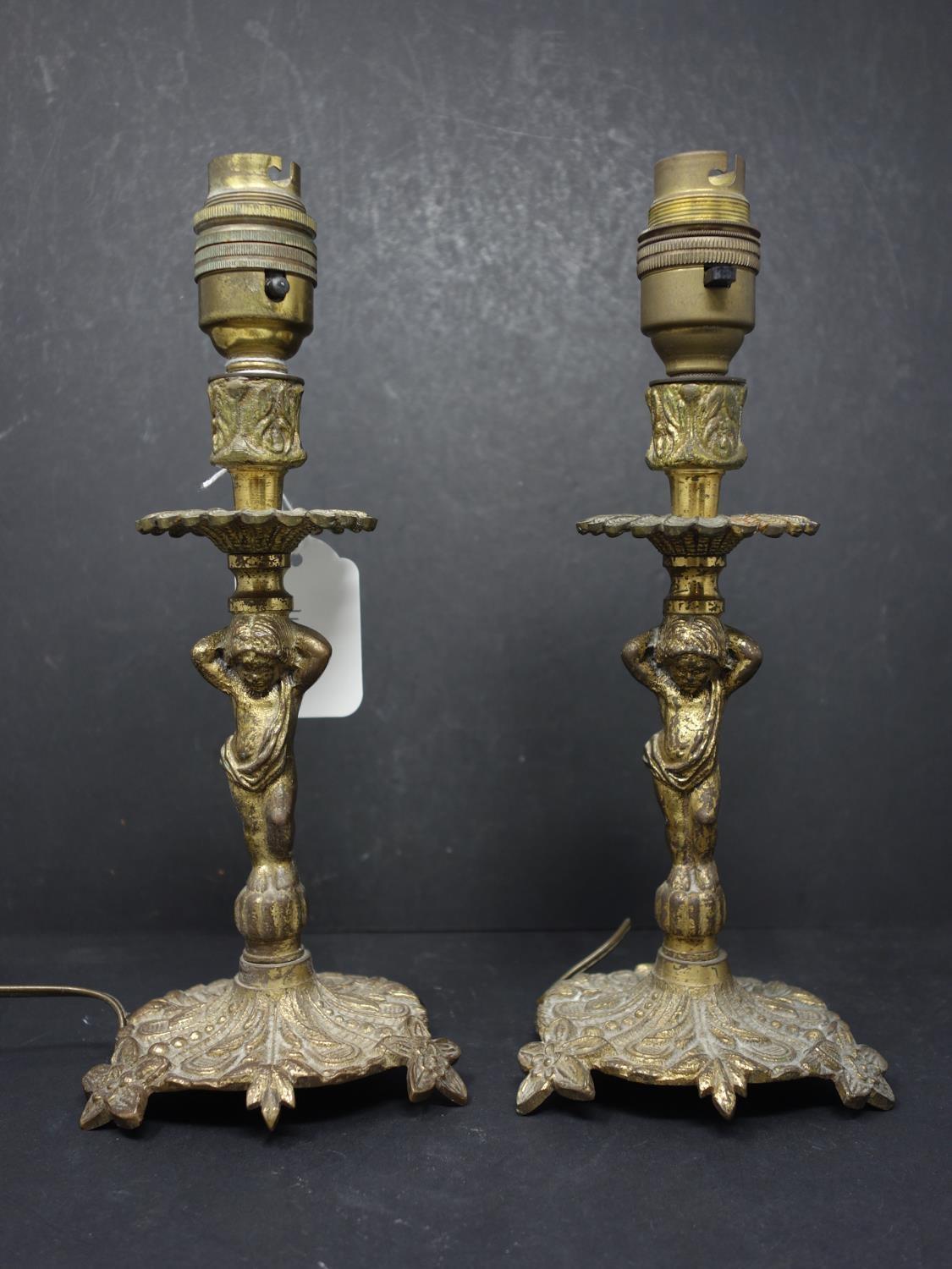 A pair of brass figural table lamps, H.24cm