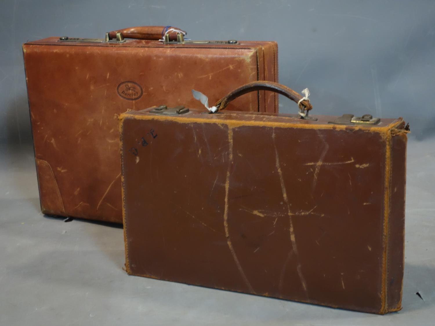 A Barclay brown leather suitcase, H.34 W.45 D.10cm, together with a brown leather writing case, H.25