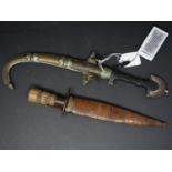 Two early 20th century Caucasian daggers, from Armenia, to include one curved dagger with white