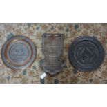 Three Middle Eastern metal trays/plates, comprising a white metal tray repousse decorated with