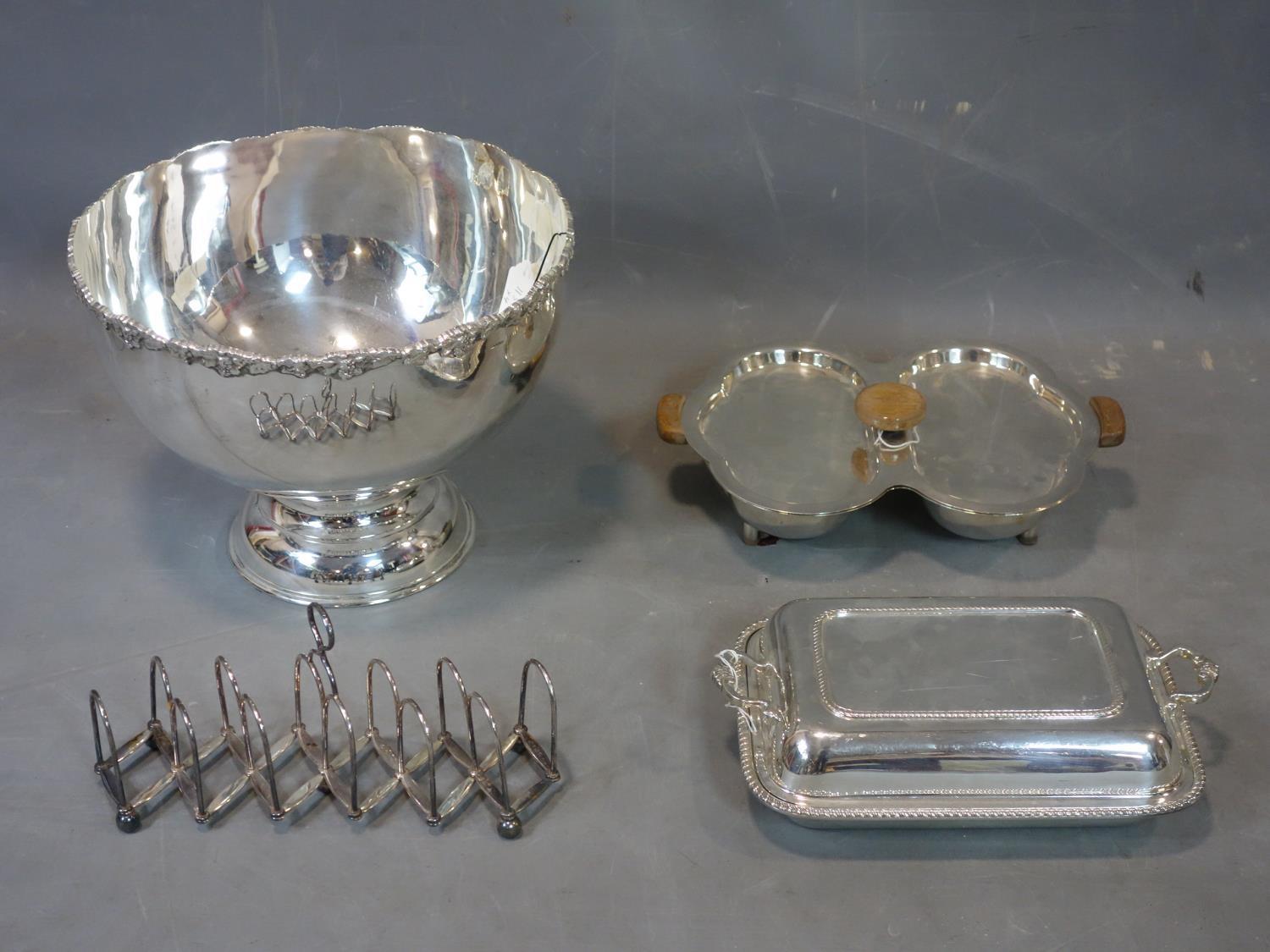 A collection of silver plated ware, to include a large bowl with grape vine rim and stepped circular