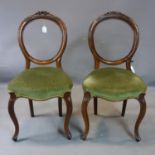 A pair of Victorian mahogany balloon back chairs