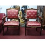 A pair of French Empire style mahogany armchairs, with gilt metal mounts, raised on reeded tapered
