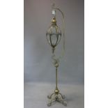 A contemporary gilt hanging lantern, on stand with scrolling supports, H.162cm