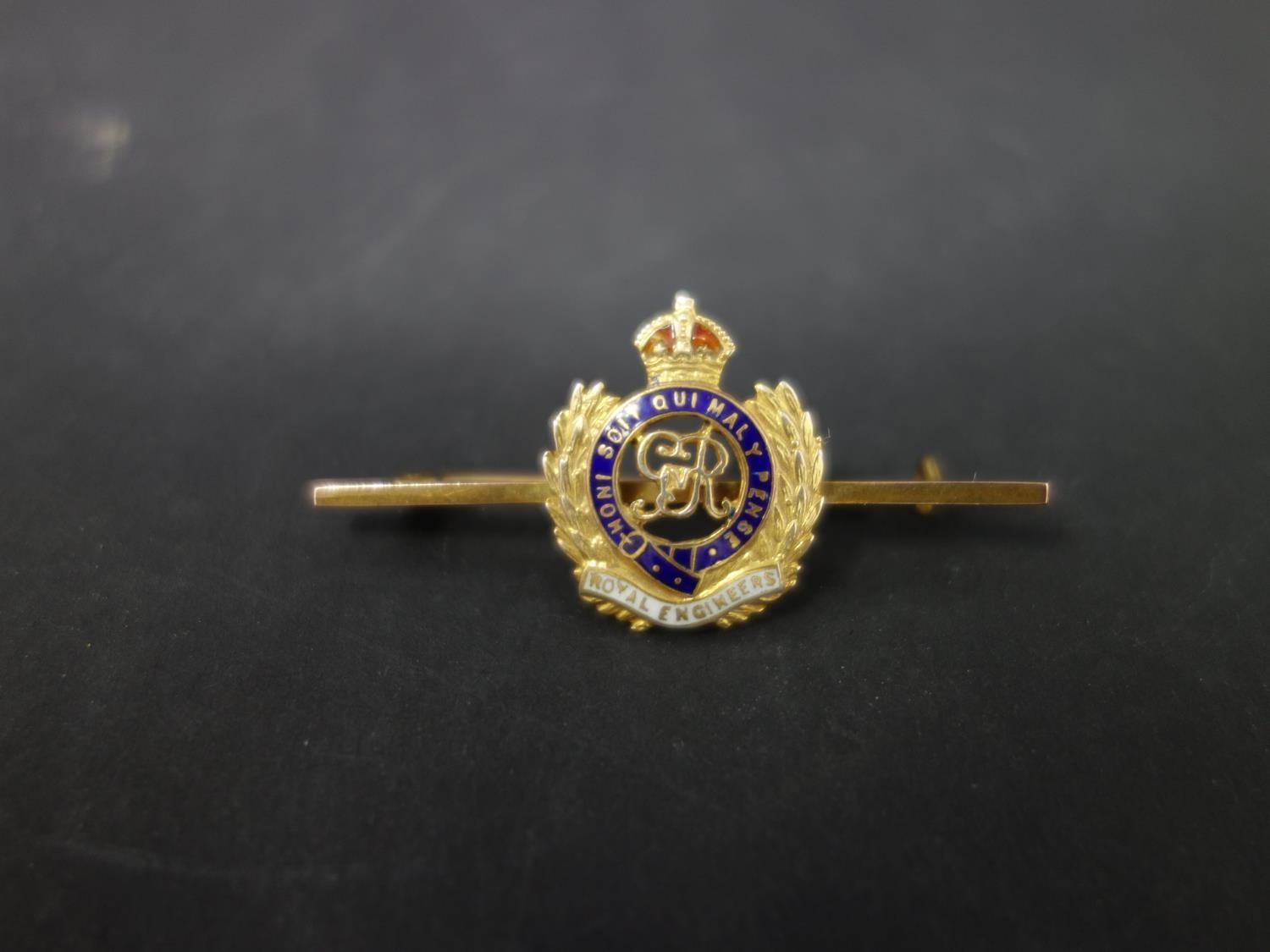 A 9ct gold and enamel Royal Engineers sweetheart pin, with George V crest, in box marked