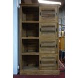 A reclaimed teak room divider/cabinet, with sliding doors and makers label for 'Raft', H.200 W.116