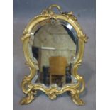 A 20th century Rococo style heavy brass easel mirror, with bevelled plate, 38 x 26cm
