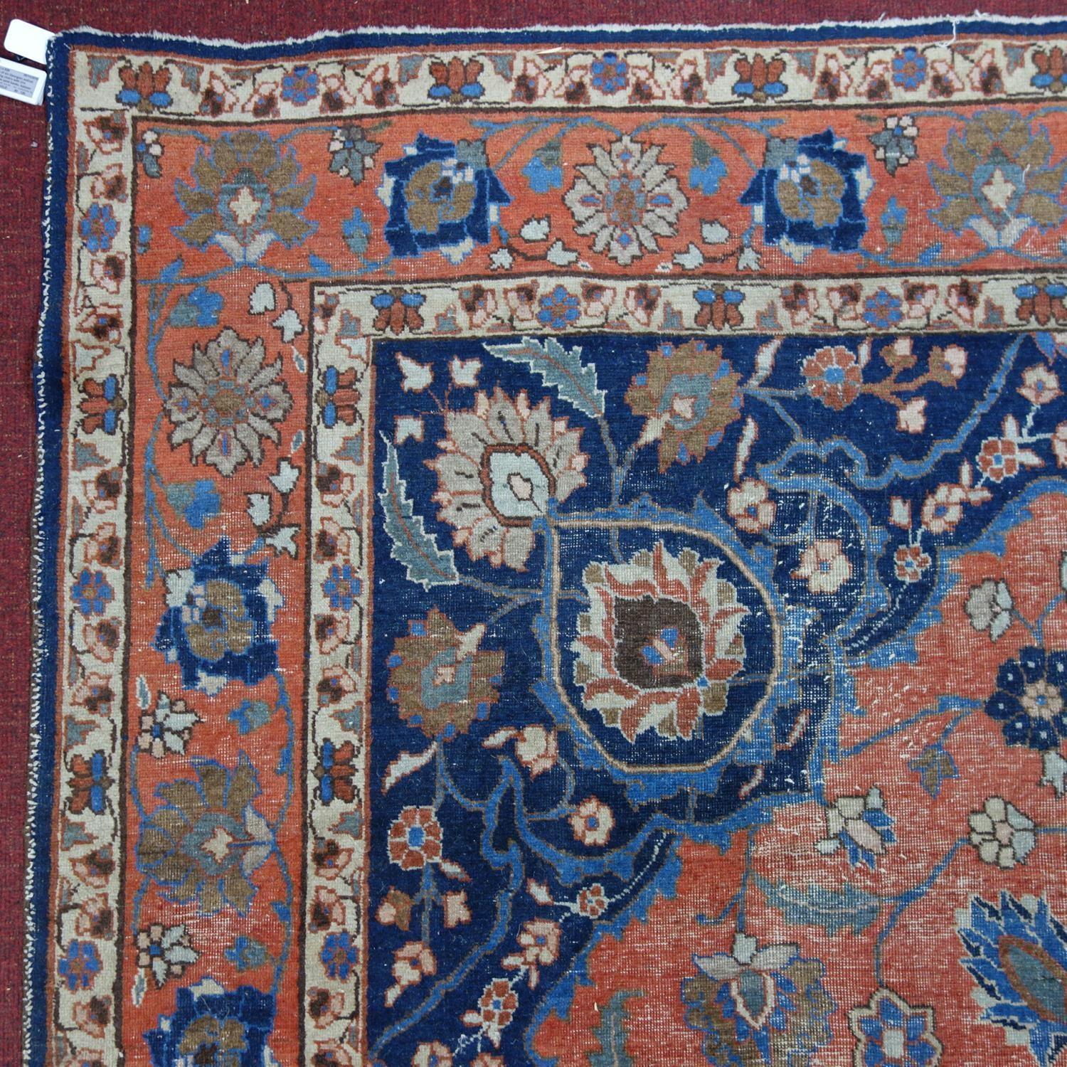 An early 20th century north east Persian Meshad carpet, the central blue floral medallion, on a - Bild 4 aus 6