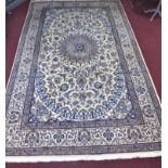 A large part silk Persian Nain Isfahan carpet, central medallion and stylised floral motifs on a