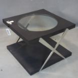 A contemporary square coffee table, with circular glass top above chrome X frame support, H.50 W.