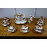 A Royal Chelsea porcelain tea set with 'Golden Rose' pattern