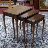 A 20th century Georgian style walnut nest of tables, H.54 W.51 D.33cm