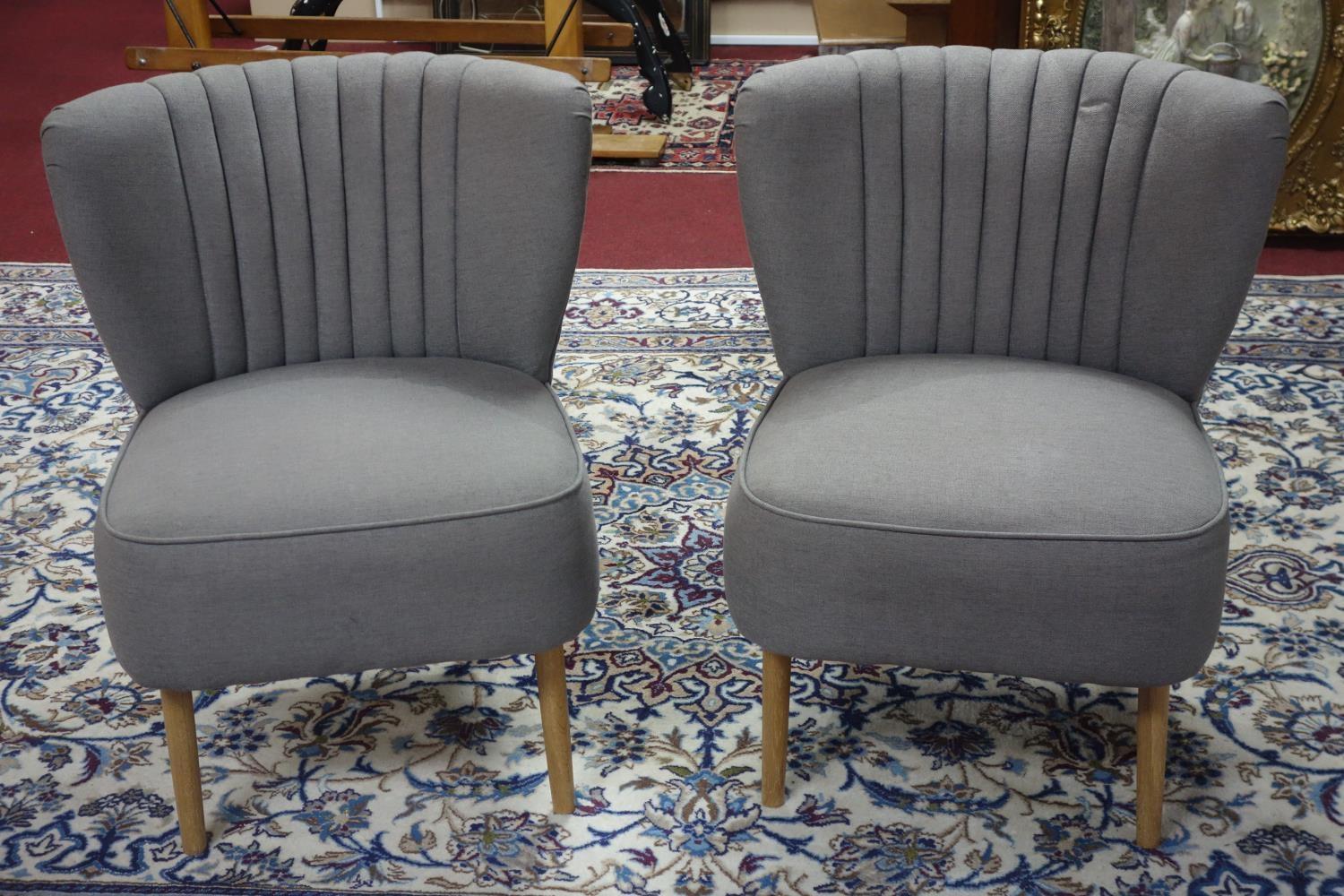 A pair of retro style cocktail chairs from John Lewis