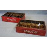 Two 24 bottle wooden crates, marked Coca-Cola, H.13 W.46 D.30cm and H.11 W.46 D.30cm (2)
