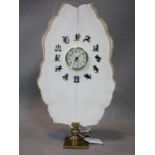 A contemporary table clock made from a white precious stone slate with zodiac signs