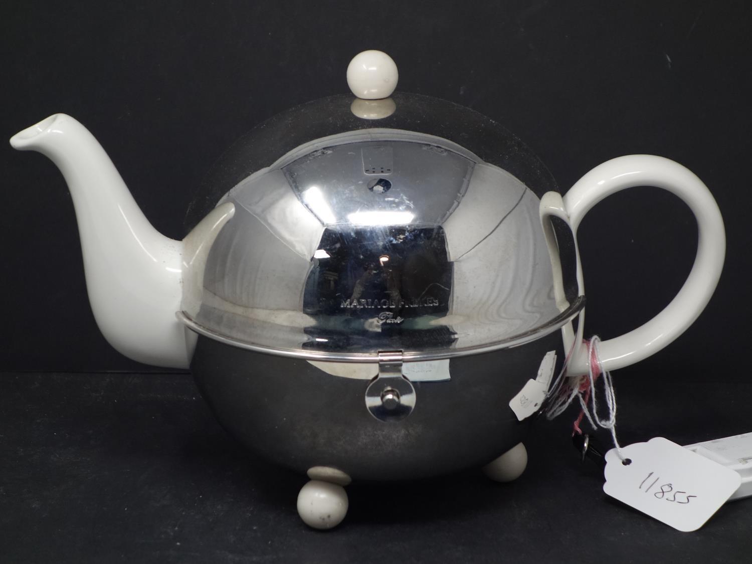 A Mariage Freres Art Deco 1930 Isotherm stoneware teapot, within polished steel globe