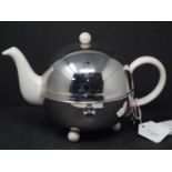A Mariage Freres Art Deco 1930 Isotherm stoneware teapot, within polished steel globe