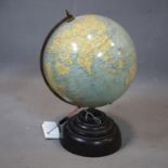 A vintage terrestrial globe, 'The Planet' by Geographia of Fleet Street, London, on stepped circular