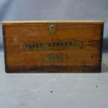 A late 19th/early 20th century pine box labelled Fleet street, H.30 W.57 D.56cm,