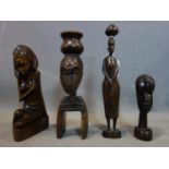 A collection of four African wood carvings 20th century