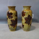 A pair of Doulton Lambeth vases, green glazed with leaf design, H.36cm