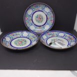 A set of three 19th century Chinese porcelain plates with floral decoration, D.23cm
