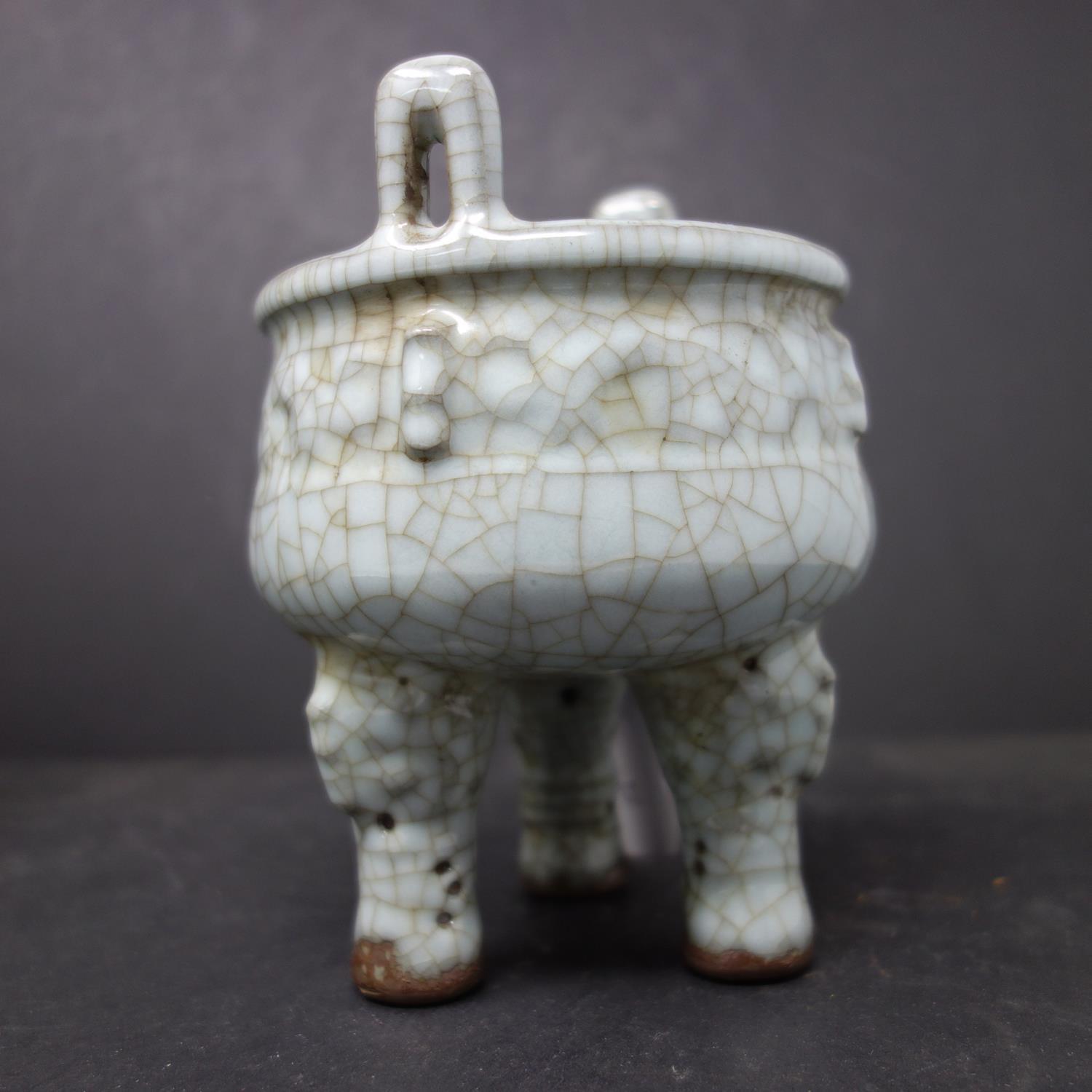 A Chinese celadon crackle glazed twin handled censor, on tripod feet, H.14cm - Image 2 of 2