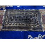 A vintage Afghan rug with geometric design, 150 x 95cm