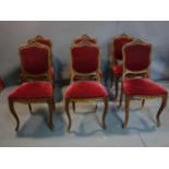 A set of 6 early 20th century French walnut chairs with velour upholstery