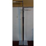 A chrome hanging rail, with two arms, raised on rectangular base, H.174cm