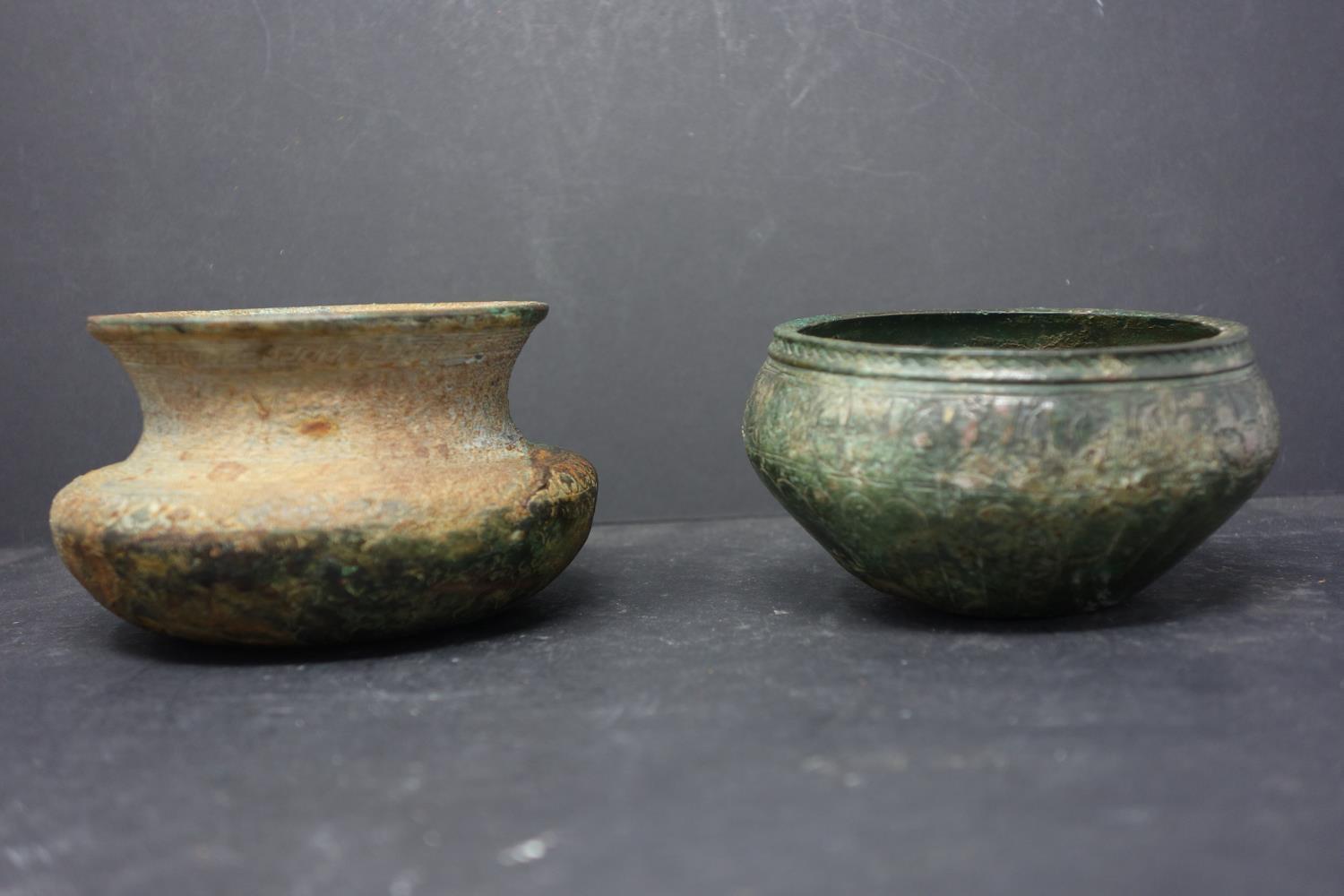 Two Islamic Khorasan bronze calligraphic bowls, Persia, each H.7, diam. 6 cm, 10th- 12th century AD