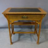 An Arts and Crafts oak desk, with leather top above single drawer, H.75 W.76 D.46cm