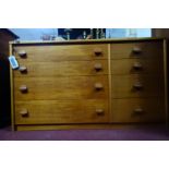 A teak chest of drawers, with an arrangement of four long and four short drawers, H.69 W.118 D.44cm