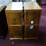 A pair of walnut pedestal chests of two drawers, on bracket feet, H.69 W.27 D.48cm