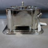 A silver plated four bottle wine cooler, with central reservoir, on a stepped base, H.24 W.31 D.31cm