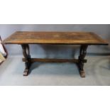 A late 19th/early 20th century oak dining table, raised on pegged trestle base, H.74 W.172 D.66cm