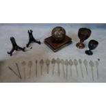 A collection of white metal pins possibly Ethiopia, together with a group of miscellaneous wooden