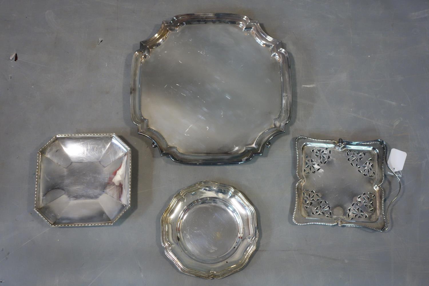 Four silver plated trays of varying size and form