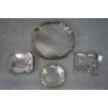 Four silver plated trays of varying size and form