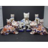 Two pairs of early 20th century Chinese ceramic cats, with character marks to base, together with