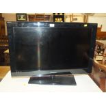 A SAMSUNG FLATSCREEN TV