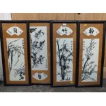 A SET OF FOUR FRAMED AND GLAZED ORIENTAL EMBROIDERIES ON SILK