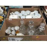 A BOX DECANTERS TO INCLUDE CUT GLASS EXAMPLES AND A SELECTION OF VINTAGE CUPS AND SAUCERS TO INCLUDE