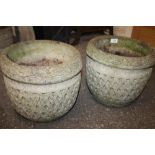 A PAIR OF LATTICE DETAIL STONE PLANTERS