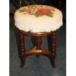 AN EDWARDIAN MAHOGANY REVOLVING PIANO STOOL