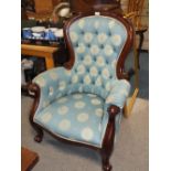 A MAHOGANY FRAMED SPOON BACK UPHOLSTERED BEDROOM CHAIR
