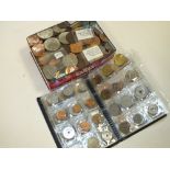 AN ALBUM OF WORLD COINS TOGETHER WITH A TIN OF VARIOUS COINAGE